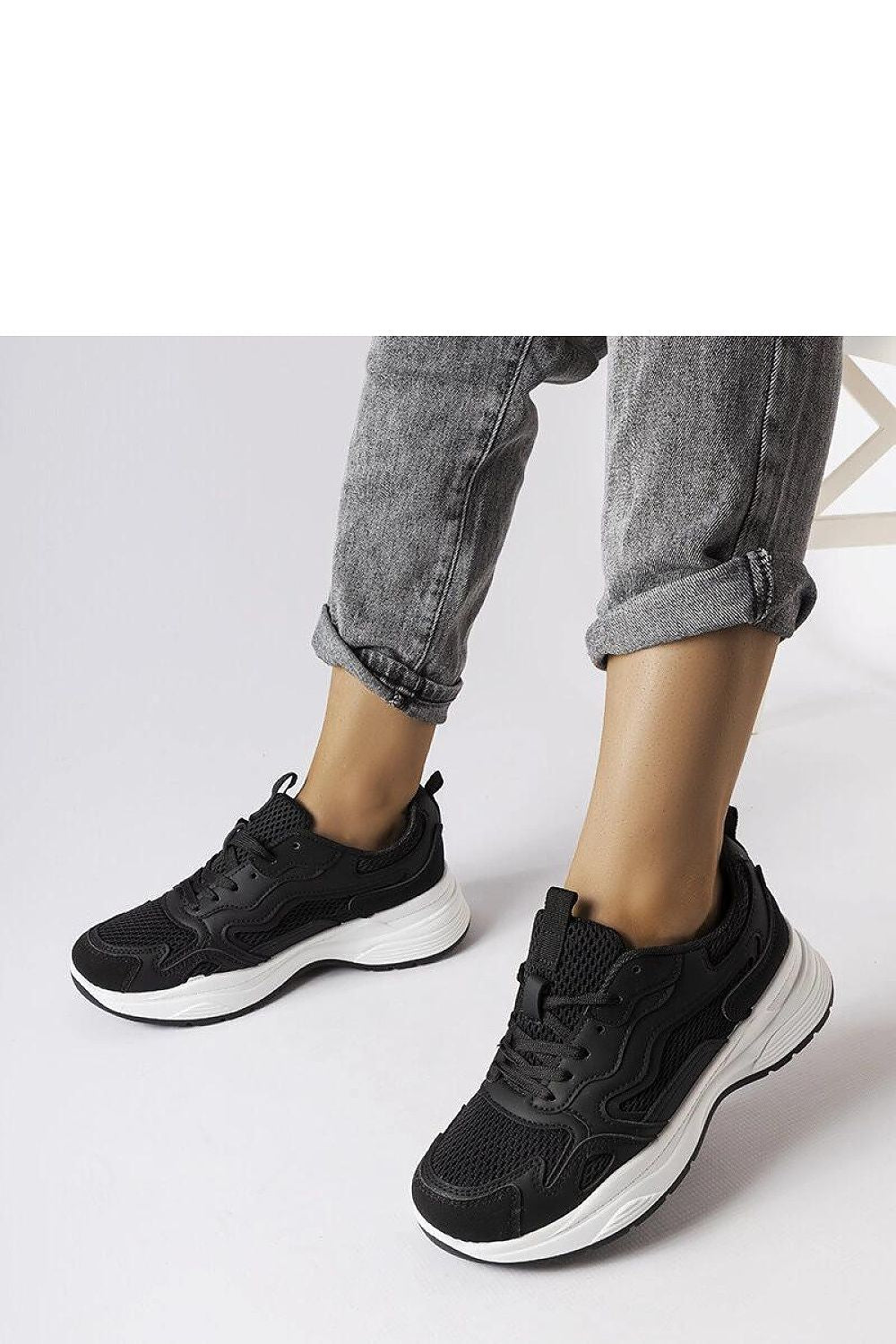 Luxury black sports sneakers by Solea showcasing high-quality synthetic leather and a stylish design, perfect for comfort and durability during everyday wear and sports activities.