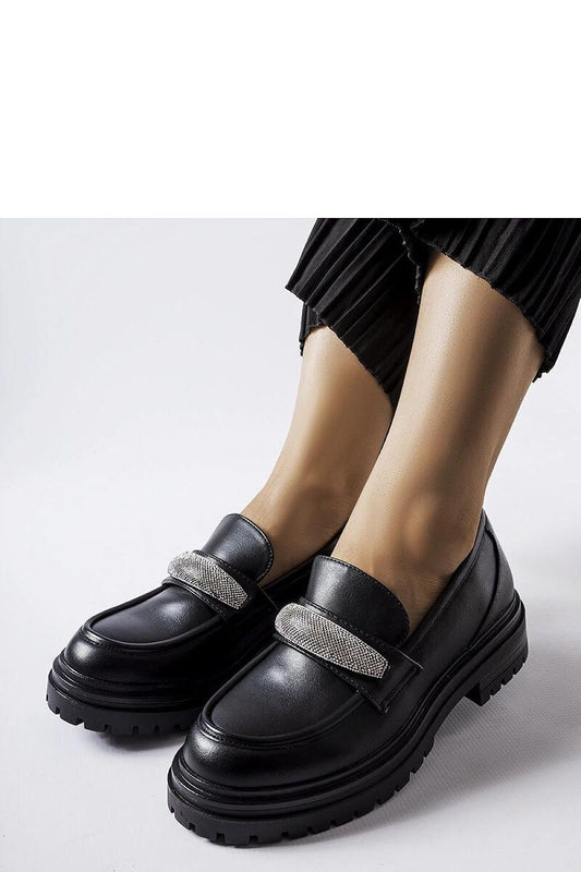 Close-up view of Solea's luxury black leather moccasins showcasing intricate zircon detailing, ideal for chic summer outfits.