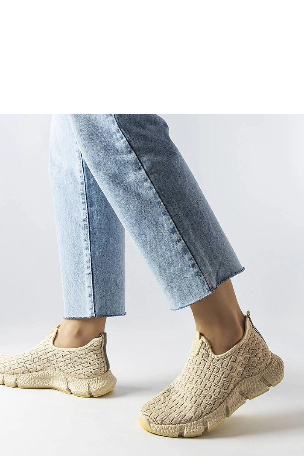 Chic light beige women’s sporty sneakers by Solea, featuring a convenient slip-on style and exceptional grip, suitable for a fashionable summer look.