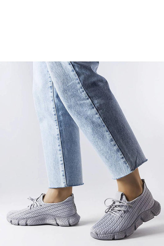 Close-up of the grey Élodie sneakers by Solea, highlighting the lace closure and rubber sole for enhanced stability during activities.