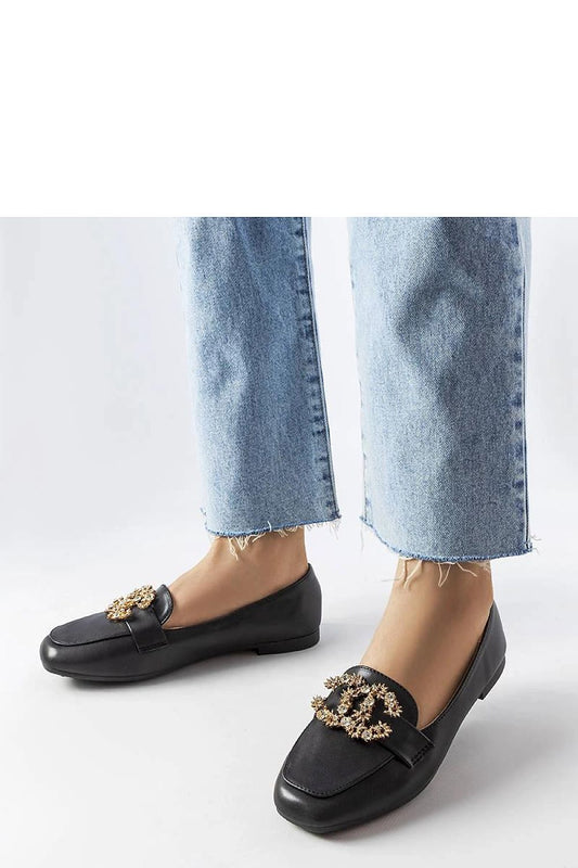 Close-up view of Solea's luxurious black eco-leather moccasins adorned with zircon decorations, highlighting their sophisticated style and comfort.