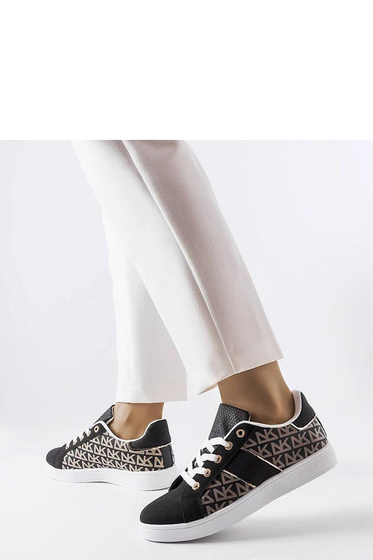 Close-up view of Solea luxury black sneakers featuring Bolduc monogram, perfect for stylish summer outfits.