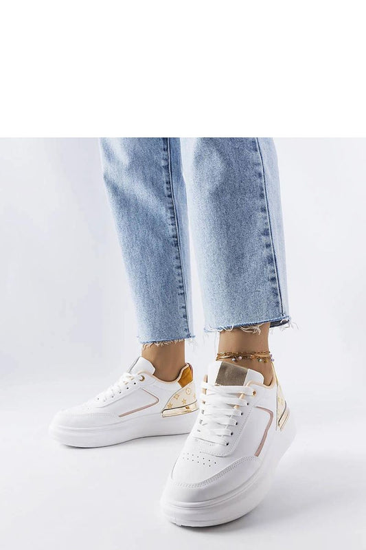 Close-up view of Solea luxurious white sneakers with beige detailing, featuring a lightweight construction and classic design ideal for fashionable summer looks.