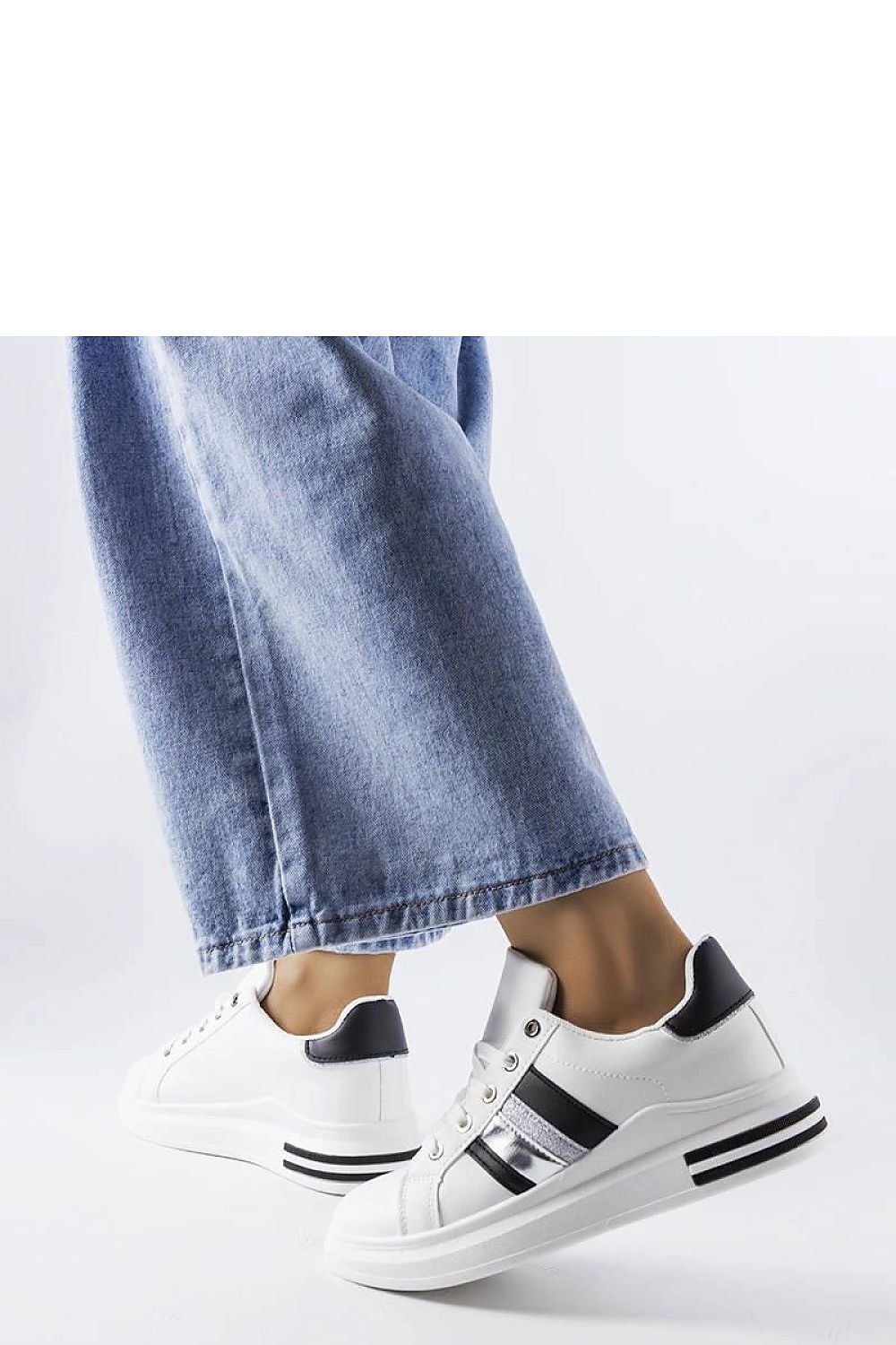 Close-up of Solea platform sneakers featuring sparkling rhinestones and a rubber sole, exemplifying sophistication and comfort for fashionable women.