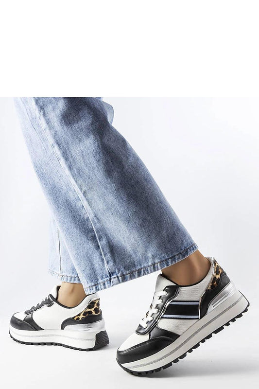 Luxury black sneakers with brocade inserts by Solea, showcasing elegant design for summer outings, perfect for combining comfort and style.