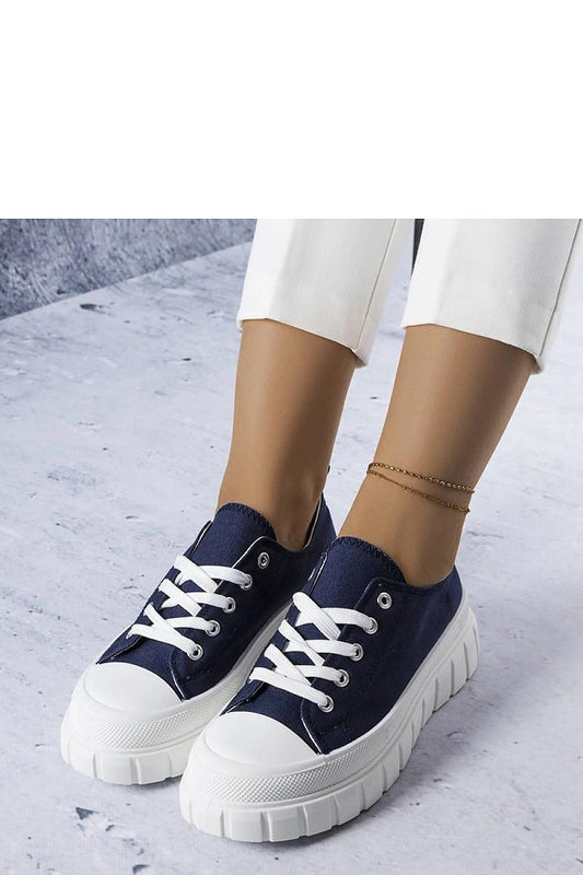 Elegant ankle-high navy blue platform sneakers from Solea, showcasing delicate stitching and a modern thick sole.