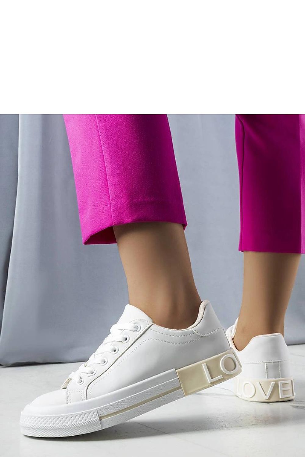 Solea's luxurious white-beige sneakers showcasing a lace-up closure, crafted for comfort and sophistication, ideal for casual outings and weekend adventures.