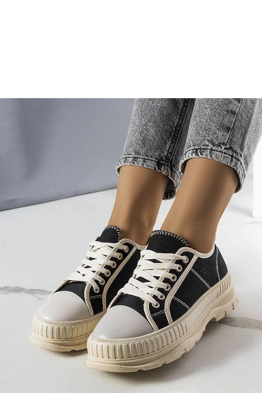 Close-up view of Solea Nichole black platform sneakers, showcasing the trendy lace-up style and textured fabric.