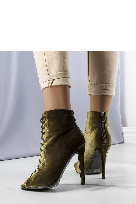 Close-up of Solea's Amora velvet ankle boots showcasing exquisite lace detail and rear zipper, designed for comfort and style.