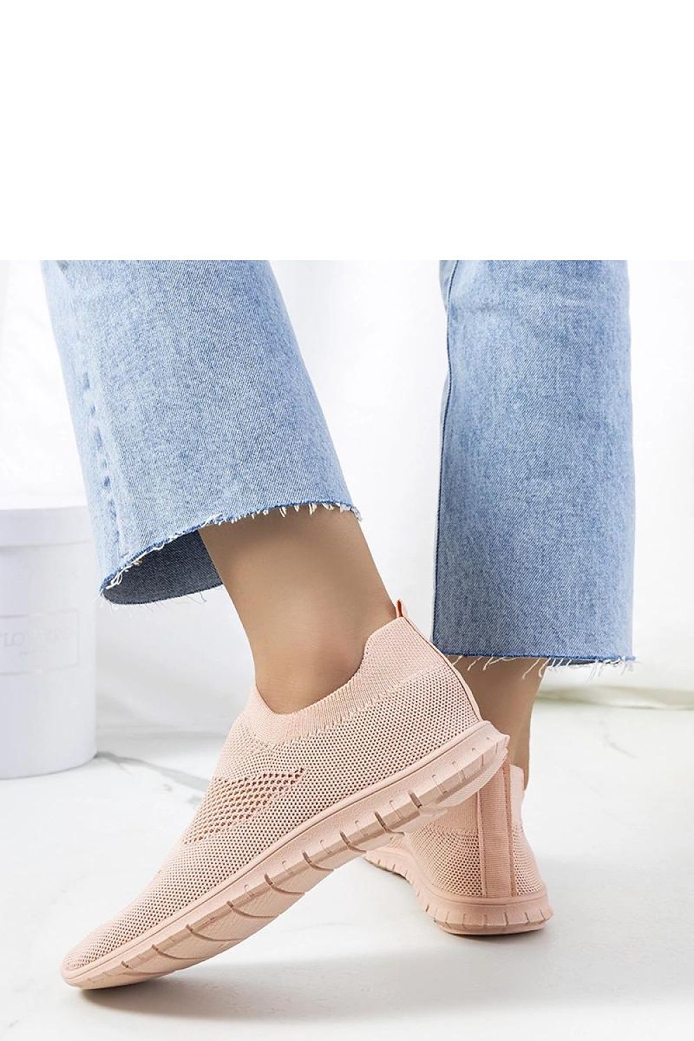 Close-up view of Solea luxury pink slip-on sneakers showcasing the pink rubber sole for excellent grip and summer-ready elegance.