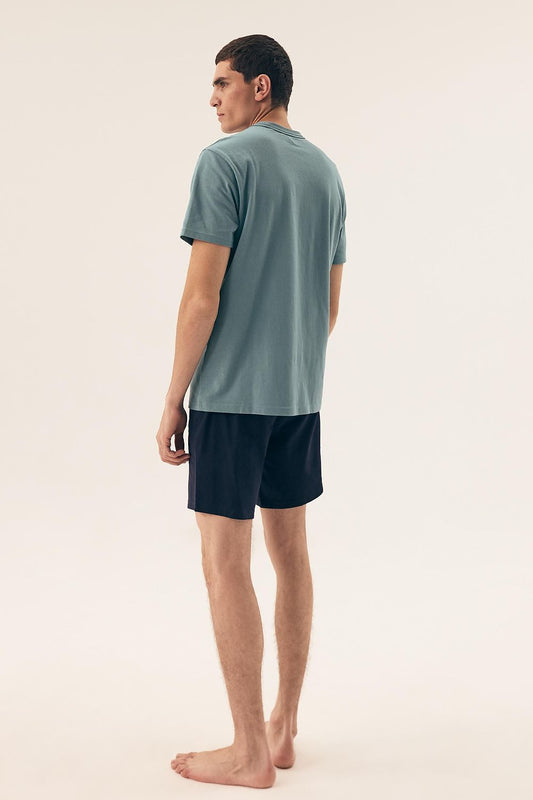 Elegant sleepwear set for men by Henderson, showcasing a classic round neckline and comfortable shorts design ideal for temperature regulation.