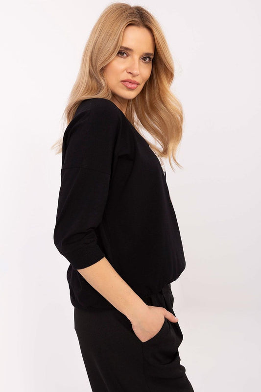 Close-up of the luxurious embroidery and pearl detailing on a cotton blend blouse by Relevance, perfect for adding elegance to any outfit.