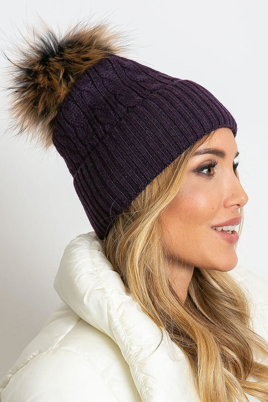 High-quality winter hat featuring a wide cuff and plush pompom by AT, made from a luxurious blend of 50% acrylic, 30% cotton, and 20% cashmere for ultimate warmth and elegance.