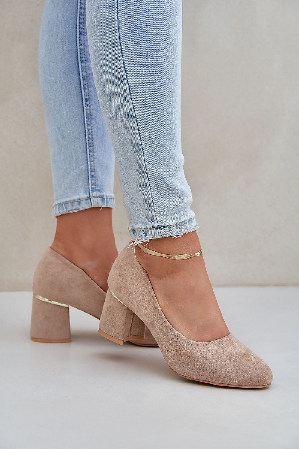 Stylishly arranged display of women's block heel pumps in various sizes EU 36-41 by Step in Style, made from premium imitation leather suede for an upscale, chic look.