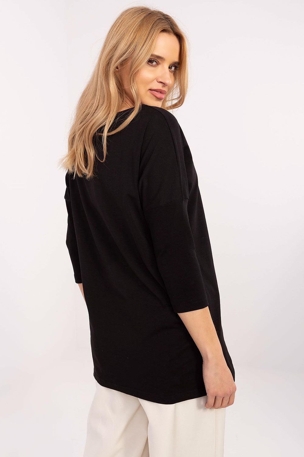 Close-up of the round neckline and longer length of the blouse from Factory Price, highlighting sophistication and style.