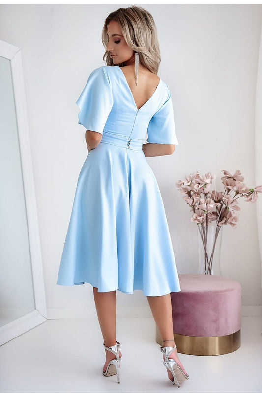 Luxurious blue cocktail dress with decorative belt and flared bottom by With You, ideal for weddings and elegant receptions.