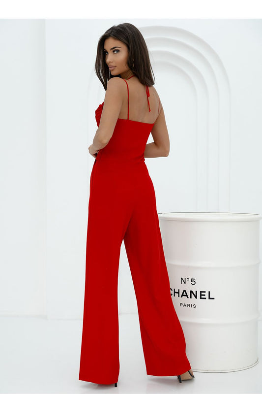 Stylish women's jumpsuit from With You, showcasing a belted waist, feminine silhouette, and chic design with thin straps and pleating.
