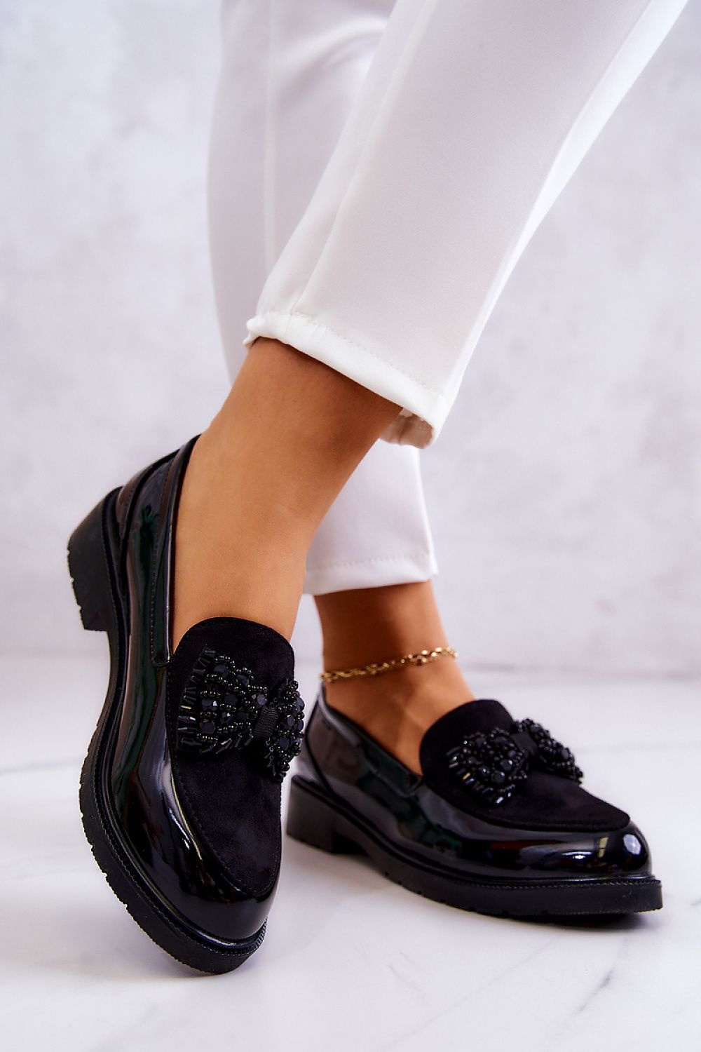 Stylish women's eco suede and patent leather moccasins from Step in Style, designed with a beautiful bow ornament, ideal for comfort and elegance.