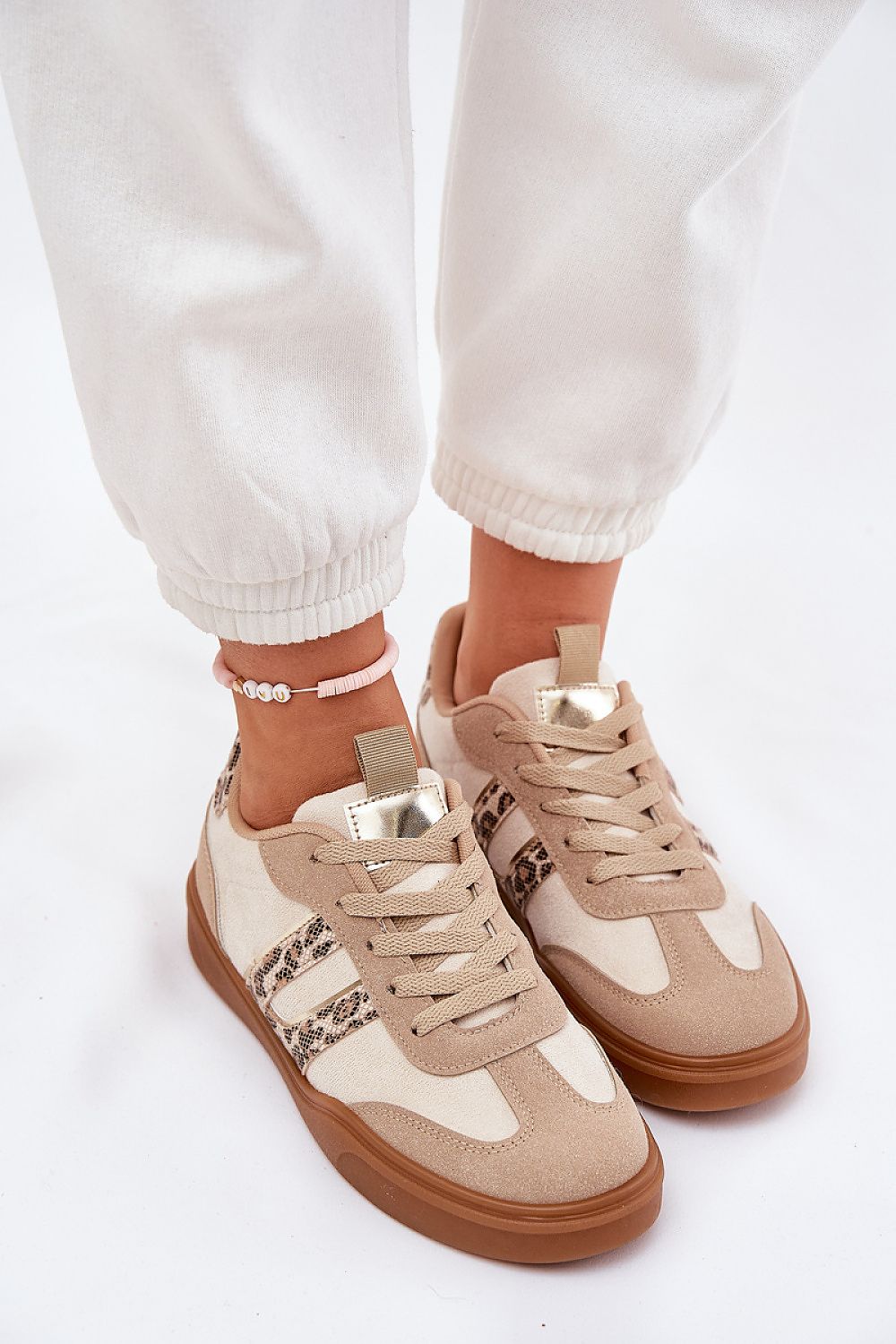 Elegant eco-friendly women's low-top sneakers by Step in Style, crafted from luxurious artificial leather, featuring soft foam insoles for all-day comfort. Available in sizes EU 36-41, perfect for adding a touch of sustainable sophistication to any outfit.