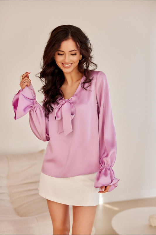 Stylish Roco Fashion blouse designed with elastic banded long puffy sleeves, crafted from 100% polyester.