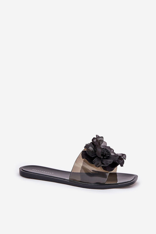 Chic slip-on flip-flops for women featuring a modern transparent upper and floral embellishment, crafted by Step in Style for effortless sophistication.