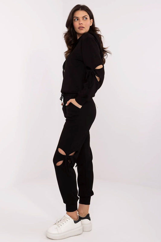 Luxury women's casual tracksuit set by NM with decorative ties and high-waisted pants in soft, comfortable fabric.