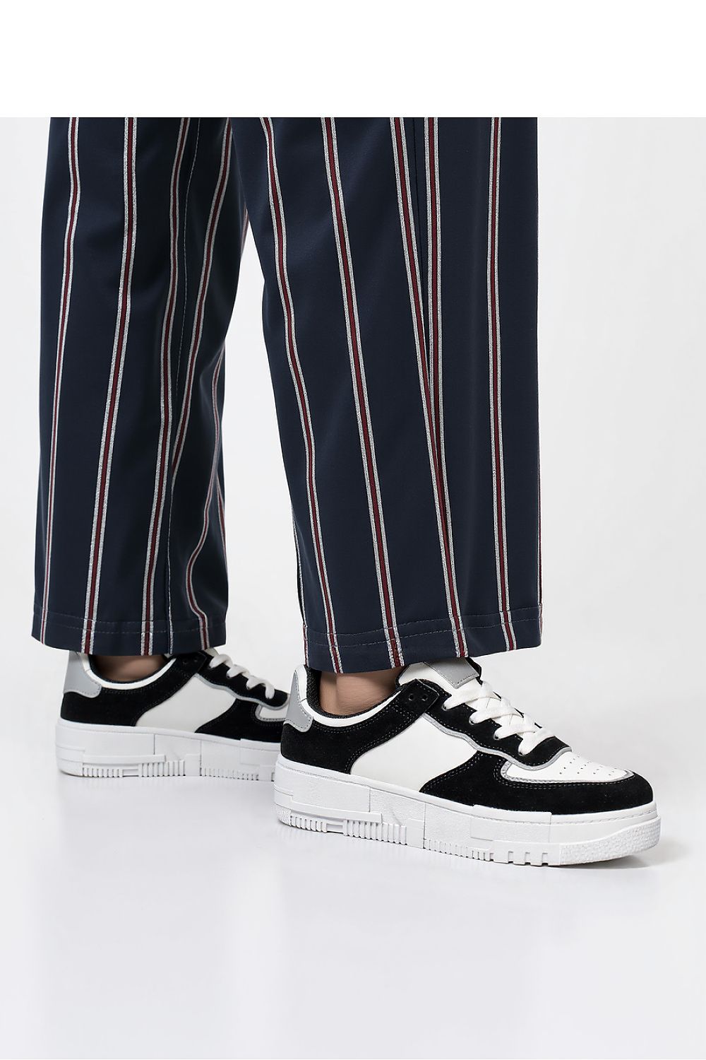 Oasis Black women's sustainable sneakers reflected on modern casual styling, crafted by Inello for ultimate comfort.