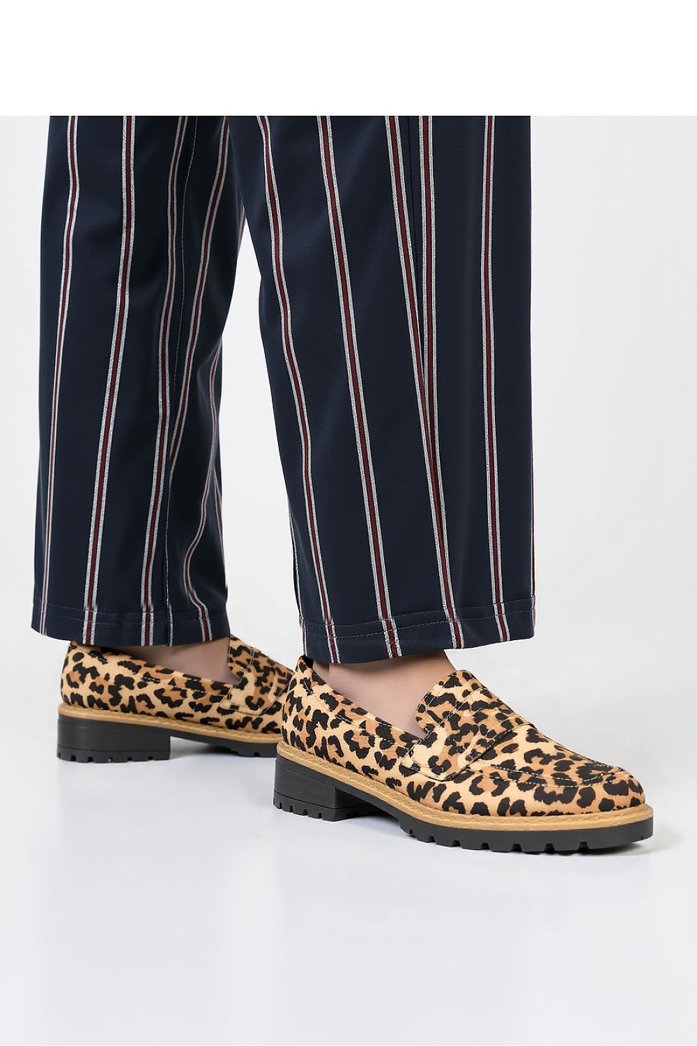 Inello Lorien Leopard Print Suede Loafers displayed with a focus on their sturdy rubber sole, combining comfort and style for the modern woman.