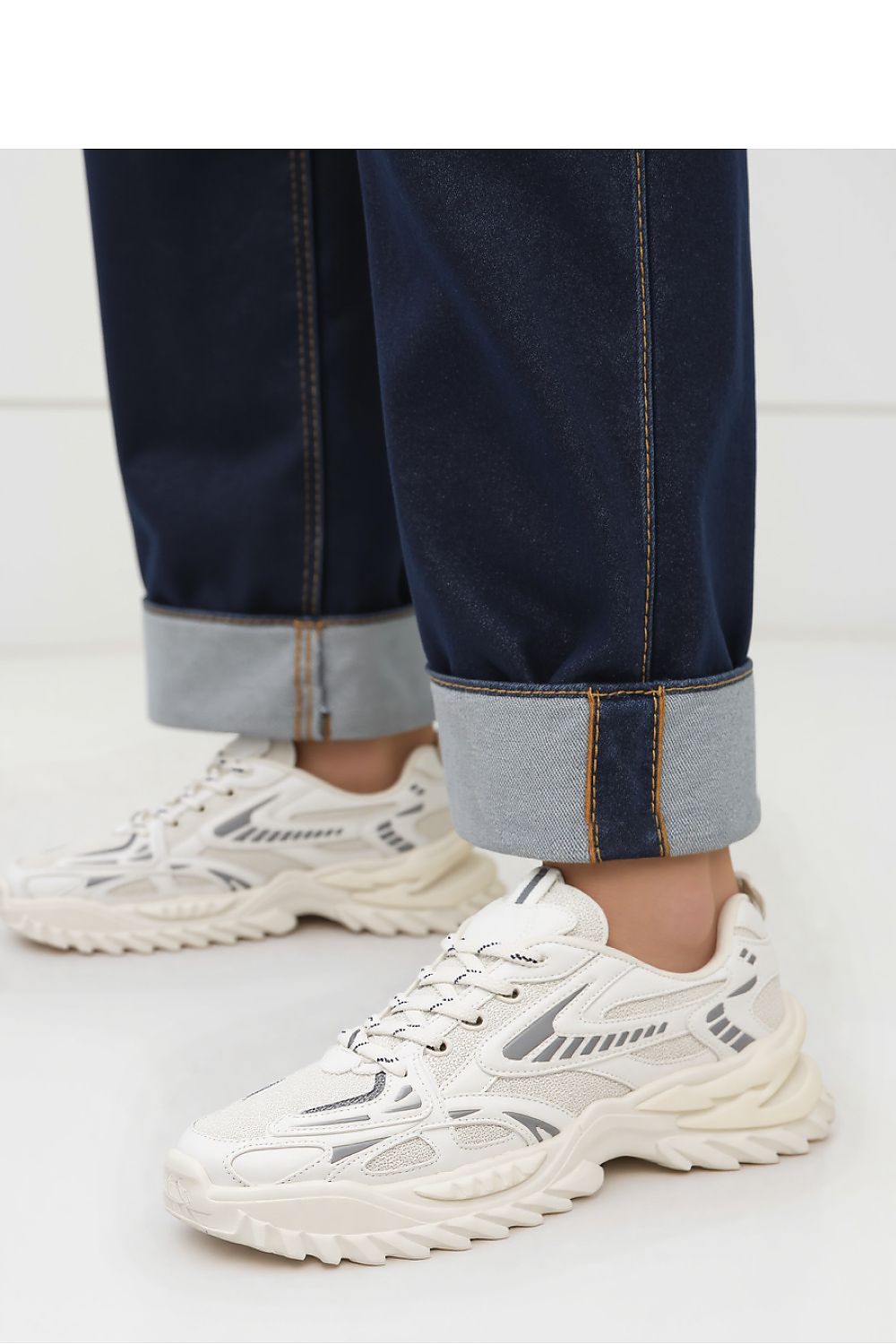 Lifestyle image of individuals wearing JAYDEN White Sneakers by Inello, demonstrating their versatility in casual and athletic settings.