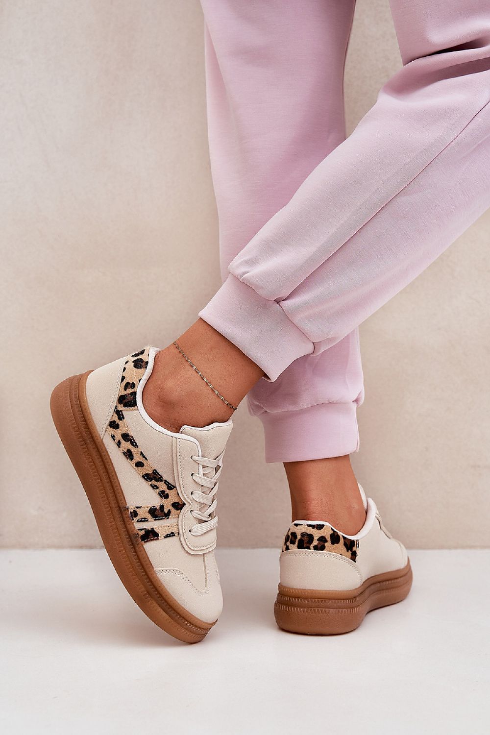 Fashionable women's platform sneakers featuring a bold leopard print on a beige background, ideal for modern style enthusiasts, created by Step in Style.