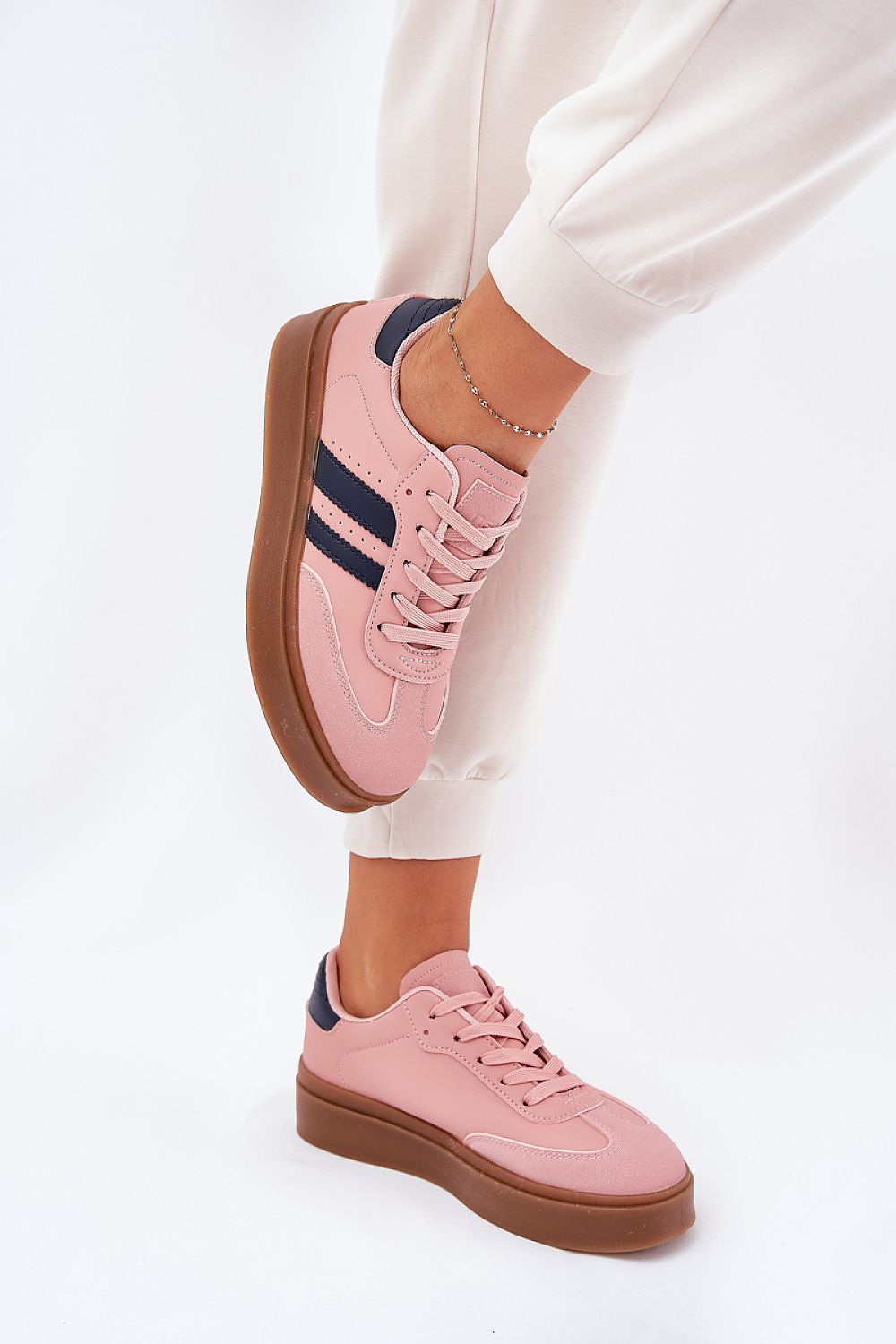 Elegant women's eco leather platform sneakers by Step in Style, presented in a stylish pink hue, perfect for casual wear, featuring a sleek rounded toe and a comfortable fit.