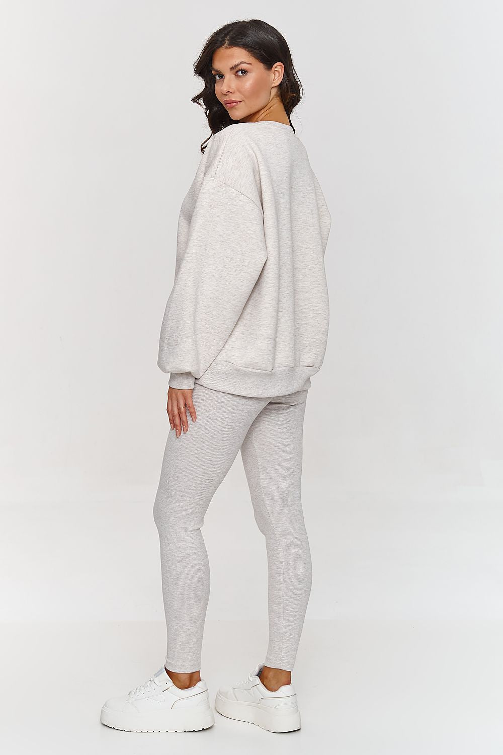 Complete luxury women's sweatsuit set by Makadamia, featuring an oversized sweatshirt and stylish fitted leggings perfect for versatile styling.