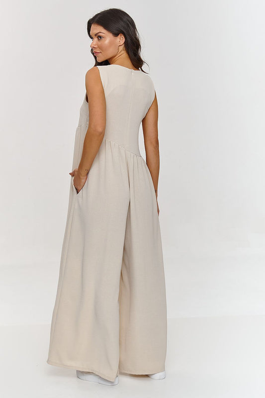 Stylish Makadamia Maxi Jumpsuit with functional pockets, showcasing a relaxed fit and breathable polyester fabric.