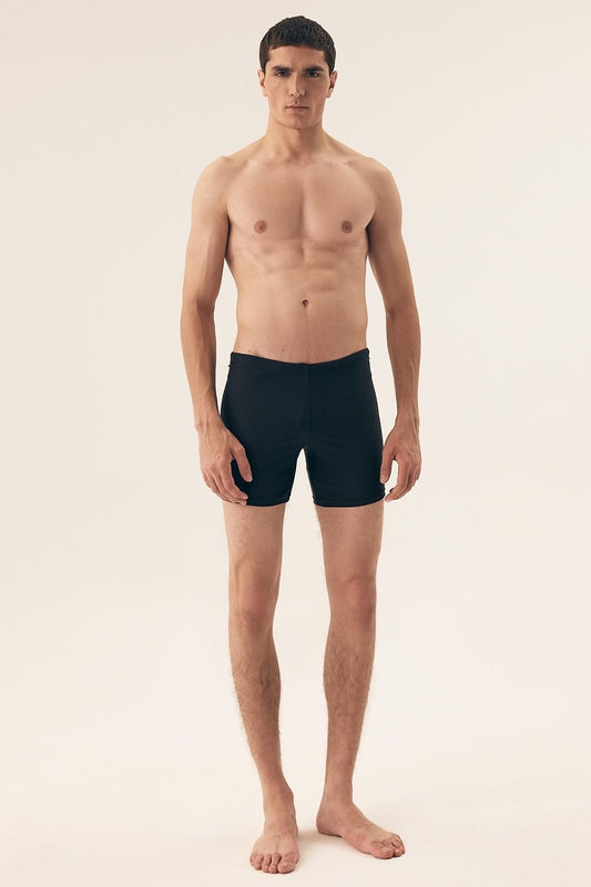 Close-up view of Henderson Men's Minimalist Swim Trunks featuring smooth texture, waist tie for a perfect fit, exemplifying elegant simplicity and functionality.