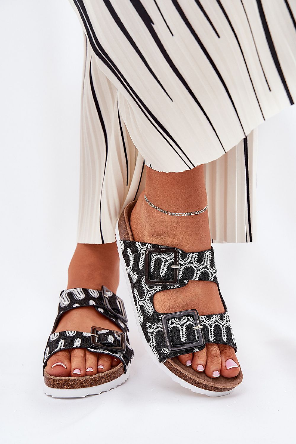 Luxury women's patterned flip-flops by Step in Style, featuring a cork platform, sequin buckles, and a comfortable suede insole, perfect for enhancing summer outfits.
