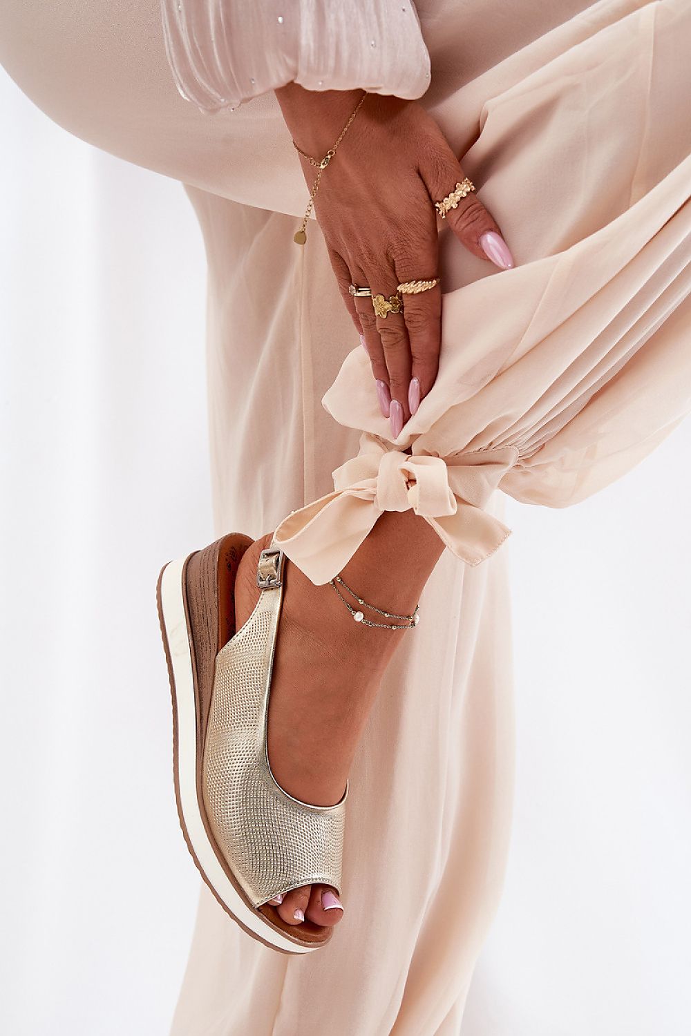 Close-up of Step in Style's women's wedge sandals, crafted from high-quality natural leather, showcasing the elegant adjustable strap design.