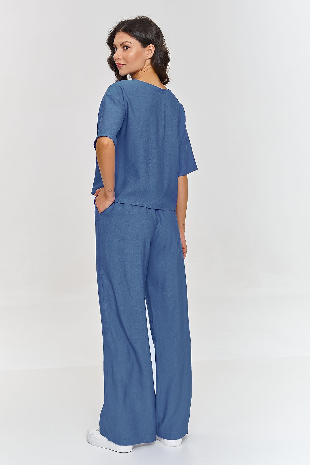 Elegant Makadamia 2-Piece Blouse and Wide Leg Pants Set in lightweight material, perfect for stylish spring and summer occasions, showcasing a sophisticated boxy blouse and modern wide-leg pants.