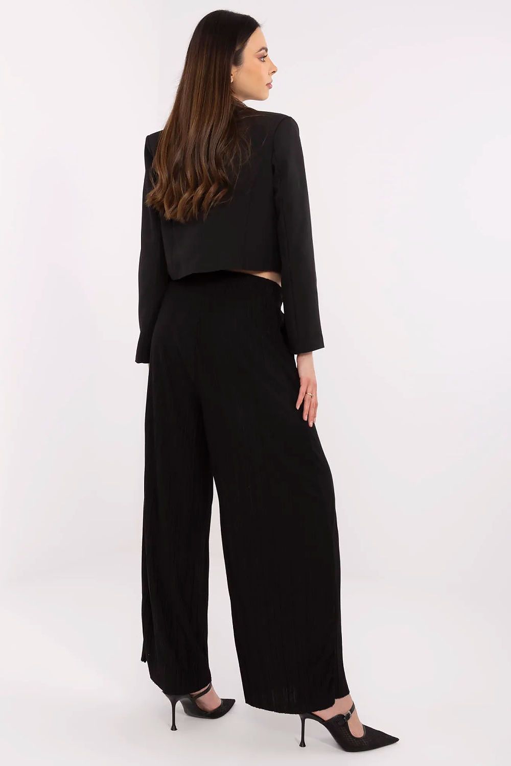 Stylish outfit styling with Sublevel's luxury high-waist wide-leg trousers, emphasizing modern elegance and comfort with a chic waist tie.