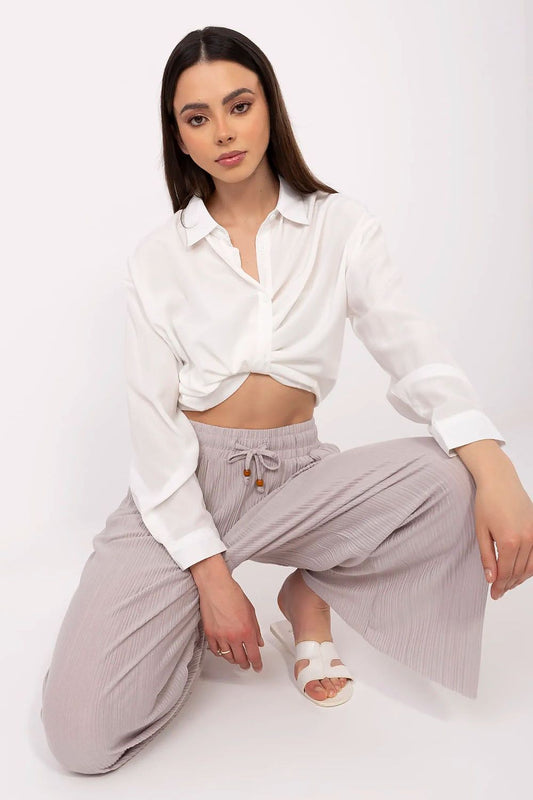 Stylish high-waist trousers for women by Sublevel, featuring a tie waist and elegant pockets, crafted in a luxe blend of viscose and polyester.