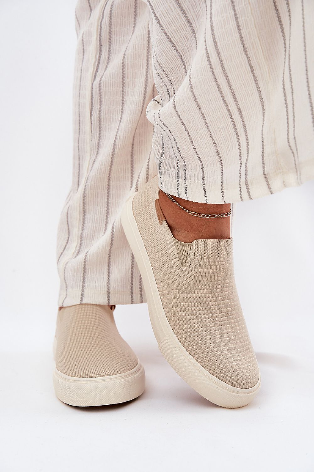 Stylish Big Star Women's Slip-On Sneakers in a chic setting, highlighting the premium fabric and essential rubber sole for effortless luxury by Step in Style.