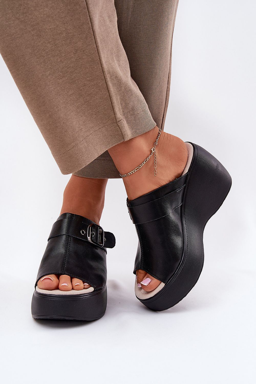 Step in Style elegant leather sandals for women with a comfortable wedge heel, perfect for casual and formal summer occasions in EU sizes 36-40.