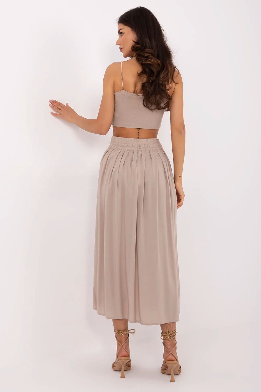 Chic and modern pleated midi skirt by Sublevel, featuring an elastic waist and concealed zipper for an effortless fit in sizes XS to XL.