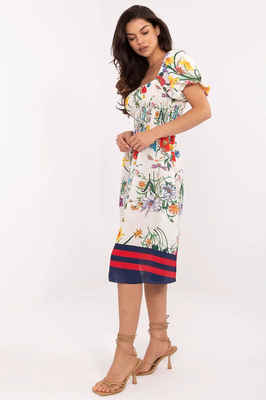 Elegant summer dress by Italy Moda featuring a flared cut and floral design, perfect for warm weather style.