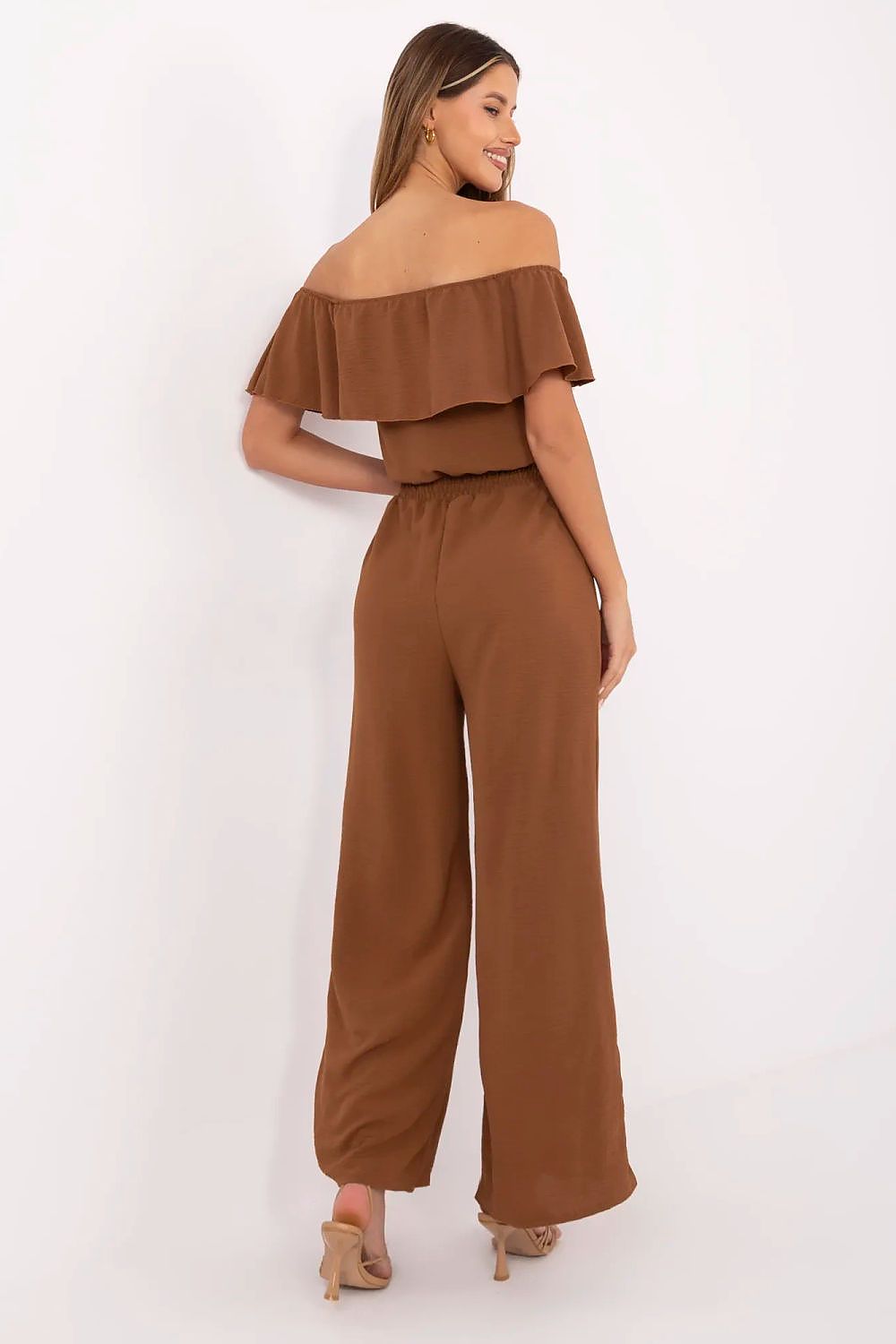 Italy Moda sleeveless jumpsuit featuring elegantly falling legs and functional side pockets, tailored for sophistication and ease.