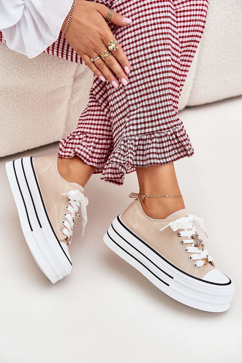 Top view of trendy women's canvas sneakers on a platform with refined gold accents from Step in Style, offering both comfort and fashionable flair.