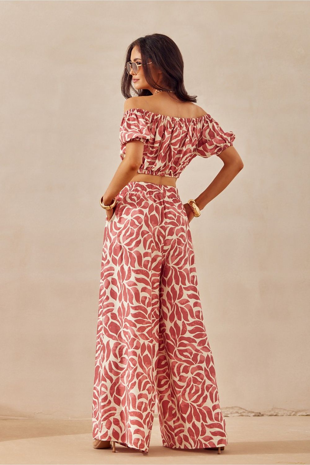 Chic and breathable women’s trousers from Roco Fashion, showcasing a vibrant animal print and a relaxed fit, ideal for fashionable summer outings.