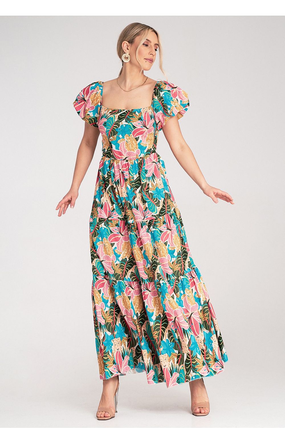 Luxurious Figl maxi dress featuring a flattering elastic bodice and voluminous layered skirt, ideal for summer gatherings.