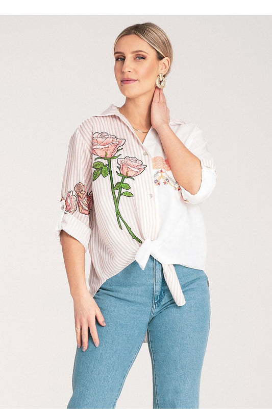 Detail view of the Figl Women's shirt showcasing its exquisite floral embroidery and classic collar design, embodying sophistication.