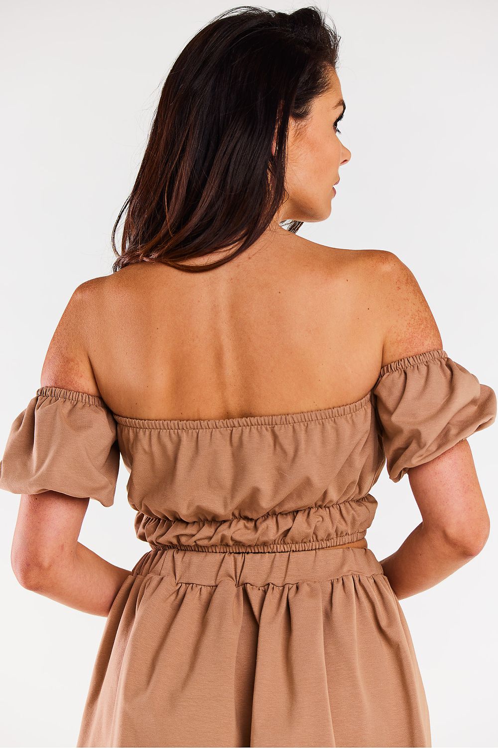 Elegant feminine cotton blouse with Spanish neckline by Infinite You, showcasing a delicate design perfect for summer attire. Available in sizes S/M and L/XL, this blouse features short sleeves and elastic finishes for a striking silhouette.