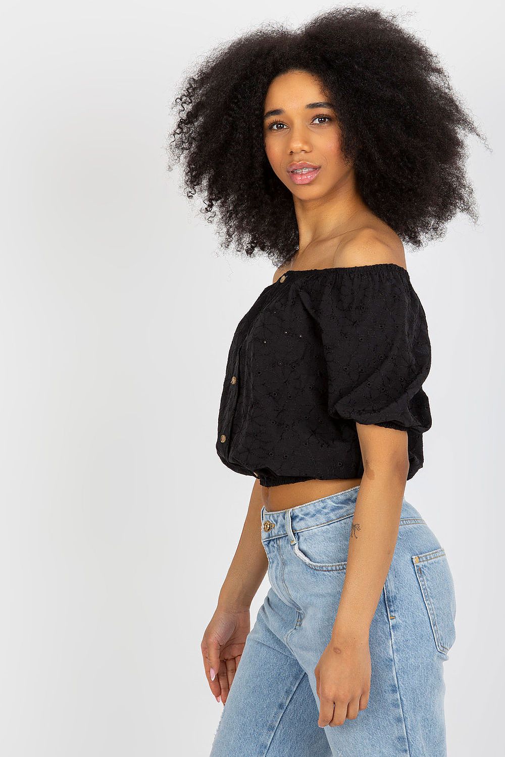 Luxurious Lakerta boho blouse showcasing a sensual neckline and decorative buttons, crafted for comfort and style in summer.